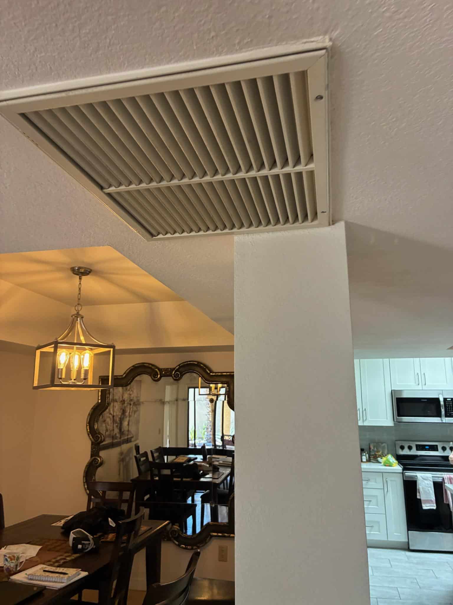 Breasy replacing an HVAC filter during a Gilbert, AZ maintenance visit