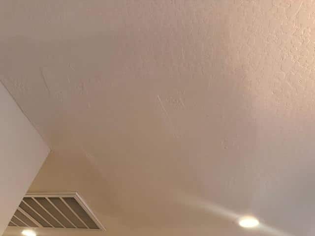 Sun-faded exterior paint on a home near the Superstition Mountains in Apache Junction, AZ