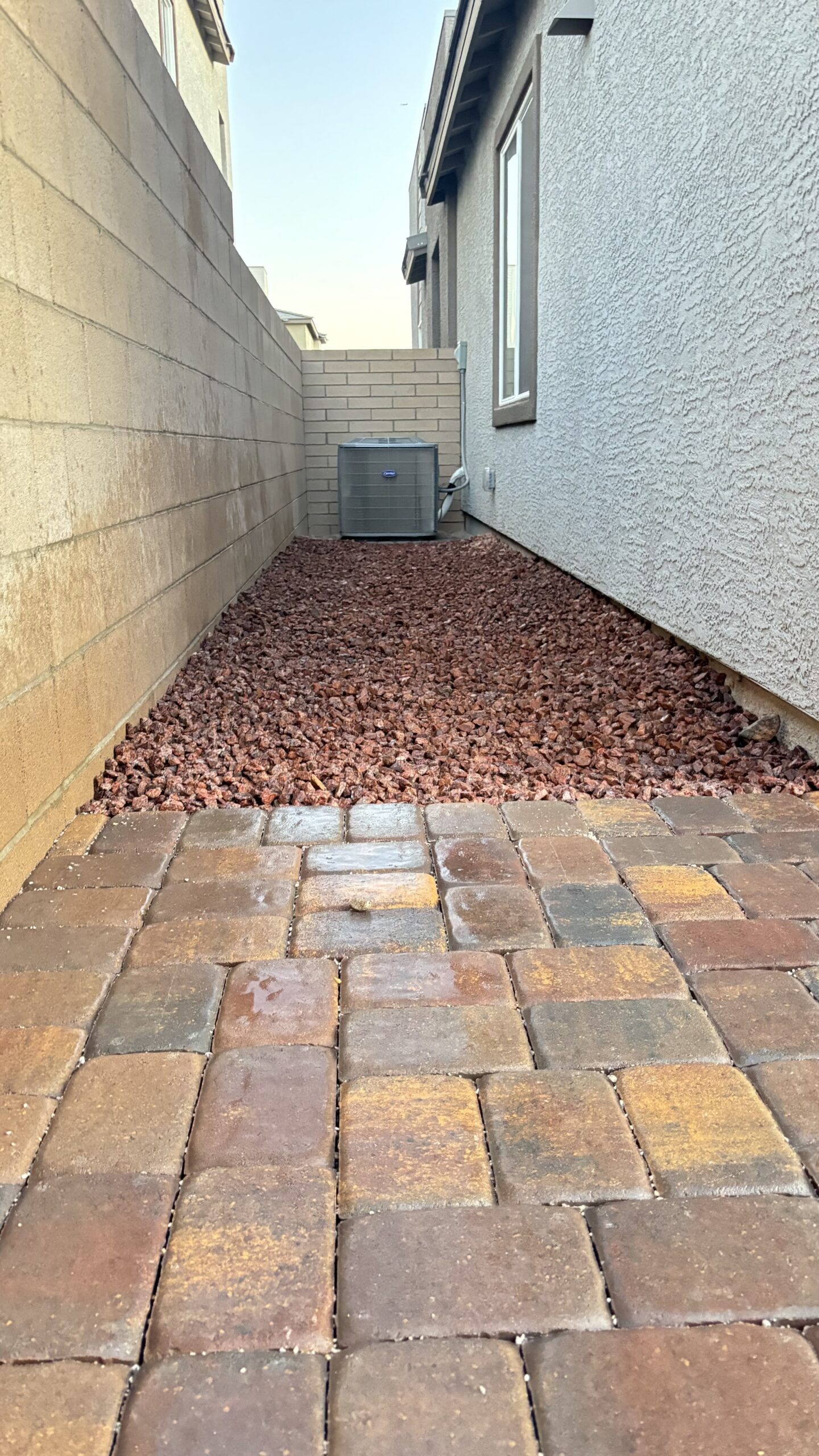 Finished paver edge and border against decorative rock landscaping